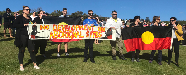 Amethyst Downing is on the left(looking at the pic)
Aaron Broad is in the middle in the white jumper.
Josephine Ball is next to Aaron holding the flag. & next to her is Trish Levitt the ALO from KMC.
There are 2 teenagers in the pic also descendants & related.

Pretty cool lot-
Josephine is a direct descendant of Queen Rosie from Minnamurra & her mum says Rosie is buried in the banks of the river.
Aaron is a descendant of King Wolloongoloo & the Walker family & he is also buried along the river.